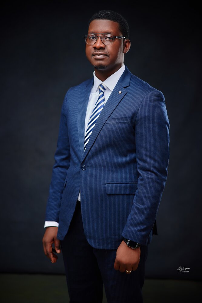 Dr. Adeyemi in professional attire